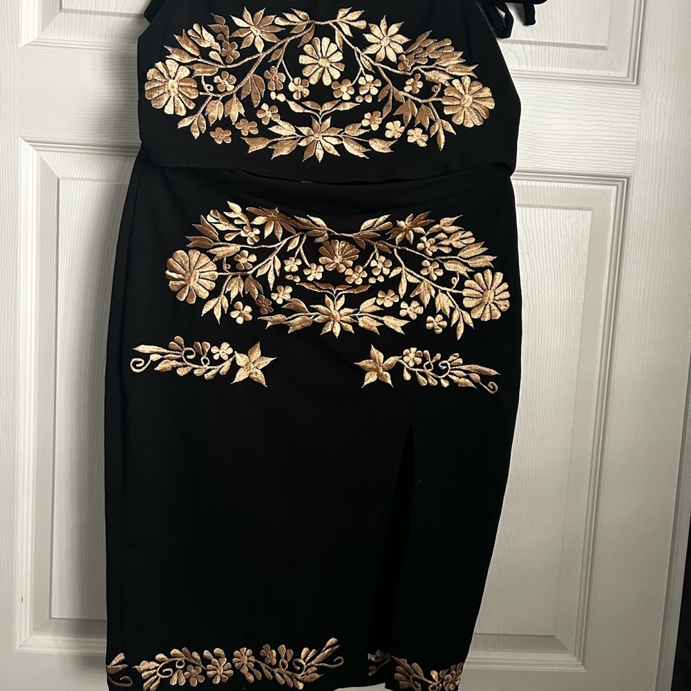 Top and skirt outfit with gold design